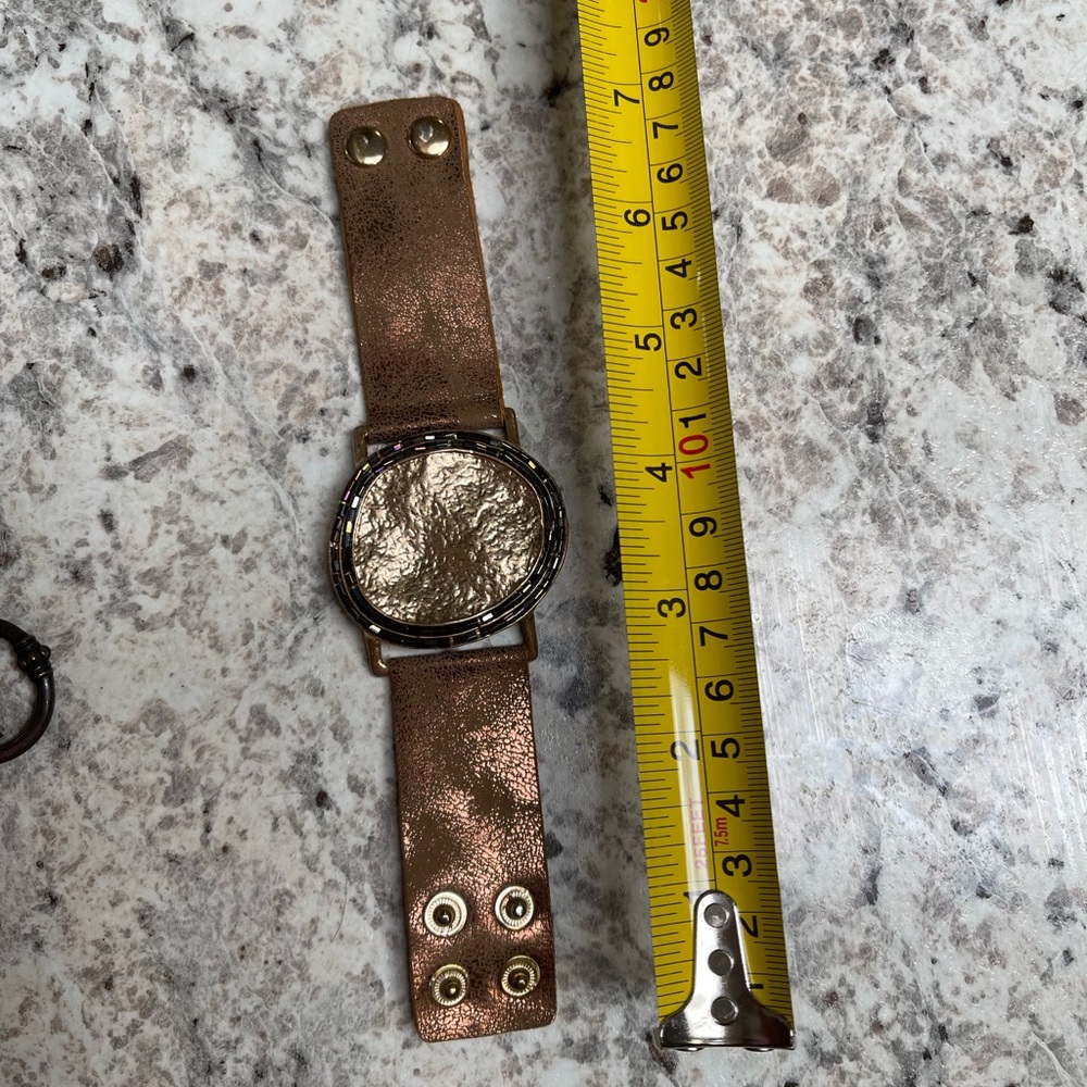 Copper colored leather and metal snap cuff bracelet